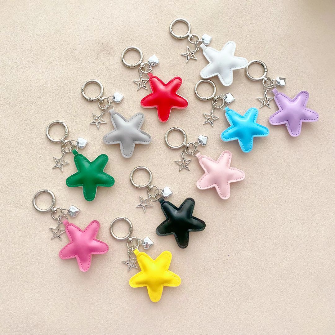 Colorful leather starfish keychain; a whimsical bag charm & key holder, perfect unique accessory.