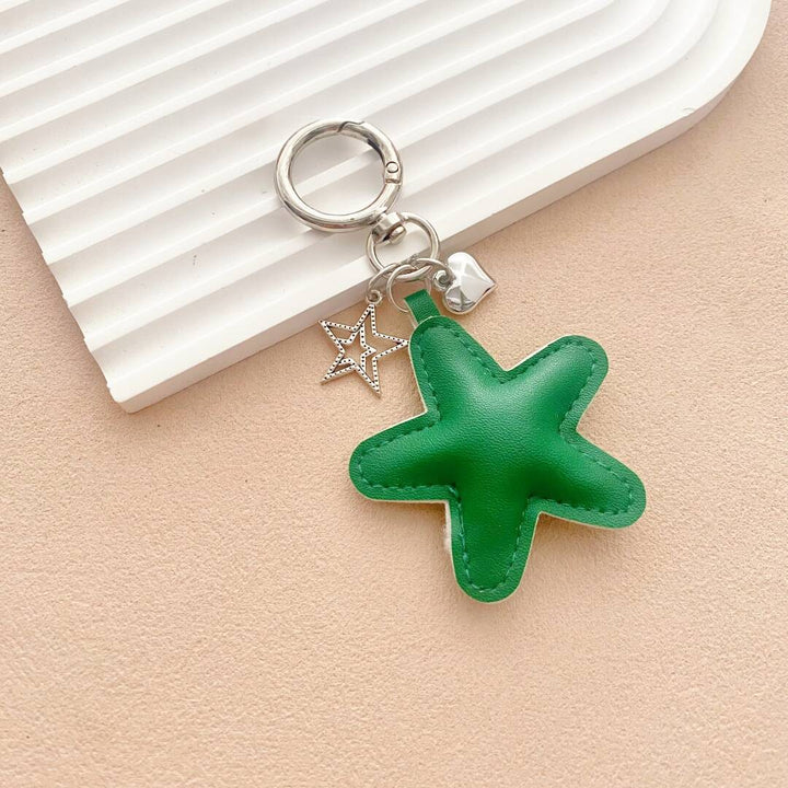 Starfish-shaped leather keychain, a fun and unique gift idea, perfect for ocean lovers.