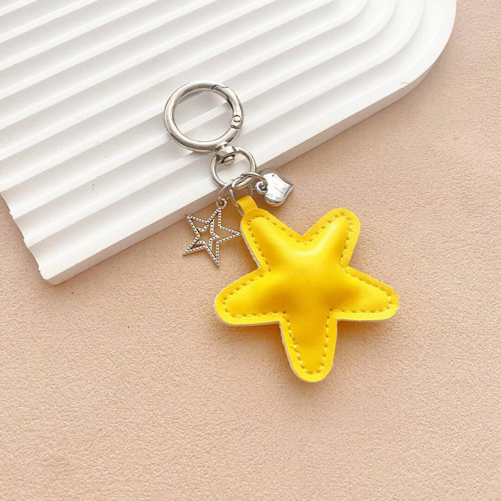 Artisan-style leather starfish keychain, a whimsical and vibrant addition to any bag.
