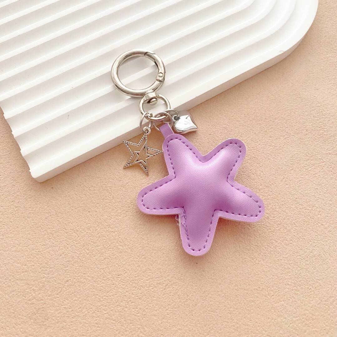 Unique colorful leather starfish, a charming bag charm and functional key holder accessory.