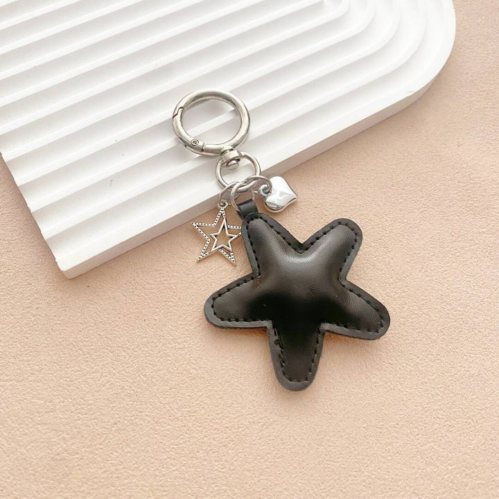 Whimsical starfish leather keychain in bright colors, a versatile bag charm and key accessory.