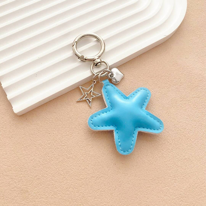 Whimsical leather starfish key holder, a bright & durable bag charm, great for unique gifts.