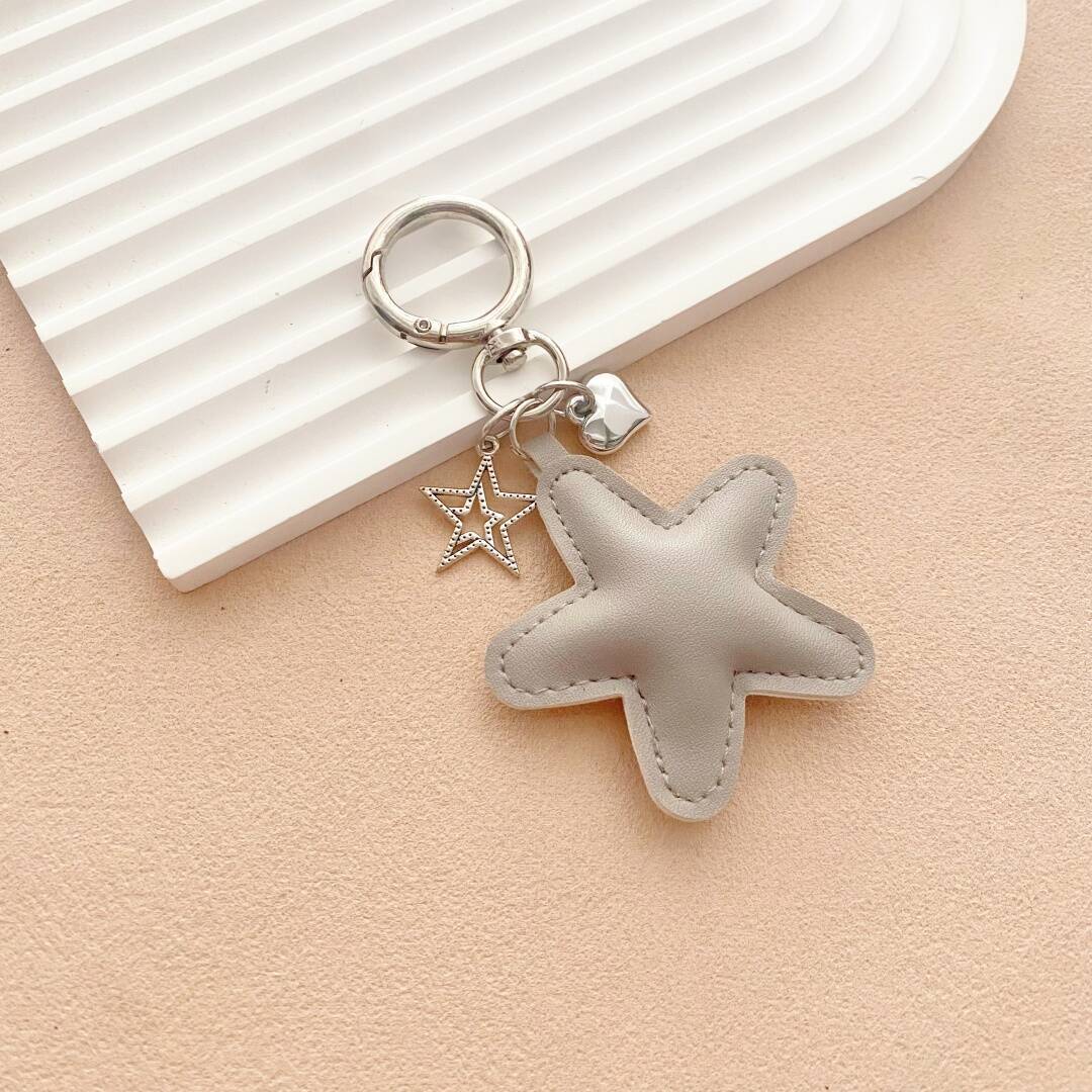 Starfish design leather keychain, a charming & colorful accessory for bags or key organization.