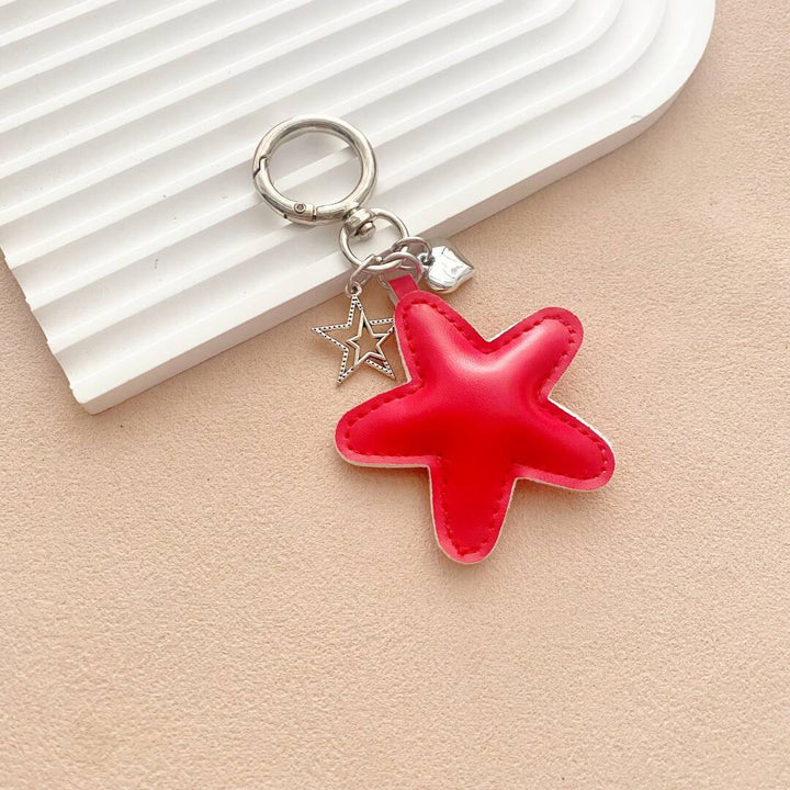 Handcrafted-look leather starfish keychain, a colorful and whimsical bag charm accessory.