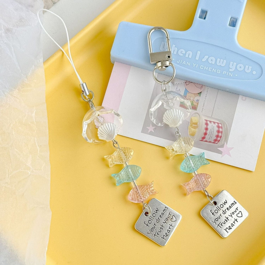 Unique marine life keychain, a perfect nautical gift. Features assorted plastic ocean animal charms.