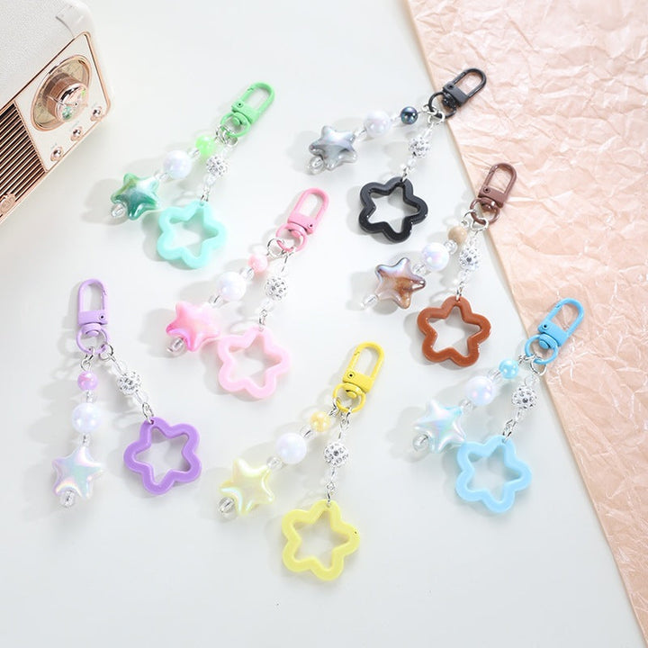 Colorful plastic floral star keychain, stylish key accessory & bag charm.
