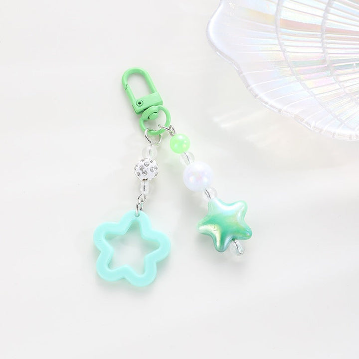 Floral star keychain, plastic bag charm keyholder, stylish accessory gift.