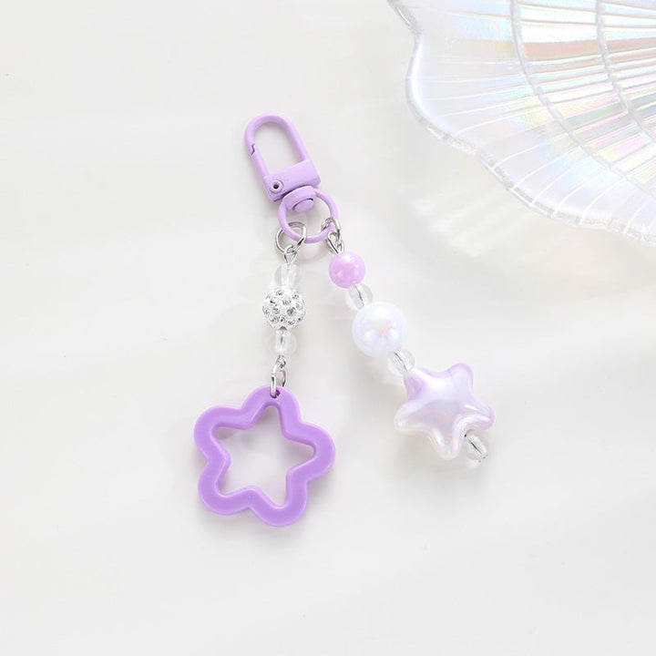 Playful floral star plastic keychain, a colorful and stylish key accessory.