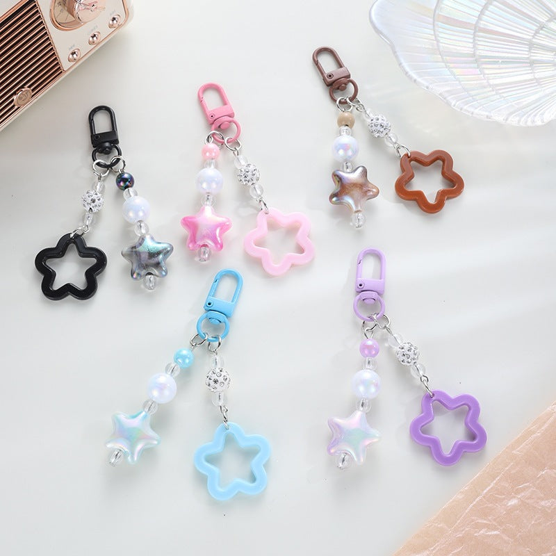 Playful floral pattern star keychain, a vibrant keyholder gift.