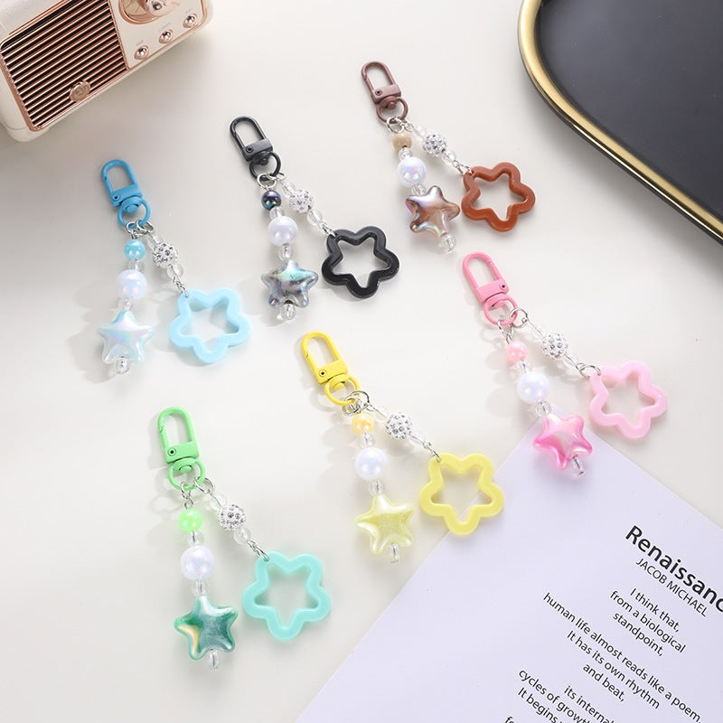 Stylish star-shaped keychain with intricate floral design, a perfect accessory.