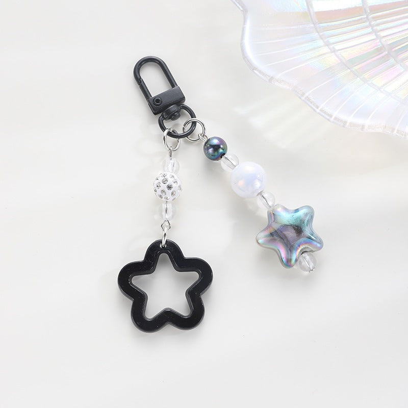 Bright plastic floral star keychain, a fun accessory for keys, bags, or gifts.