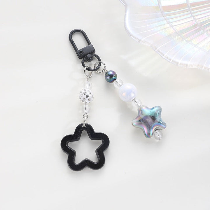 Bright plastic floral star keychain, a fun accessory for keys, bags, or gifts.