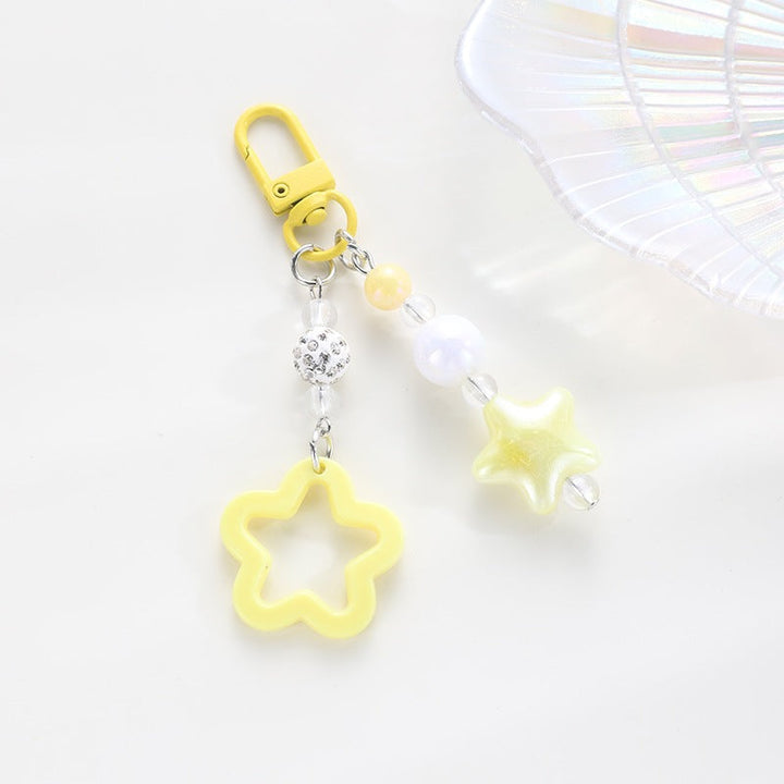 Whimsical floral star design keychain, a stylish and eye-catching key accessory.