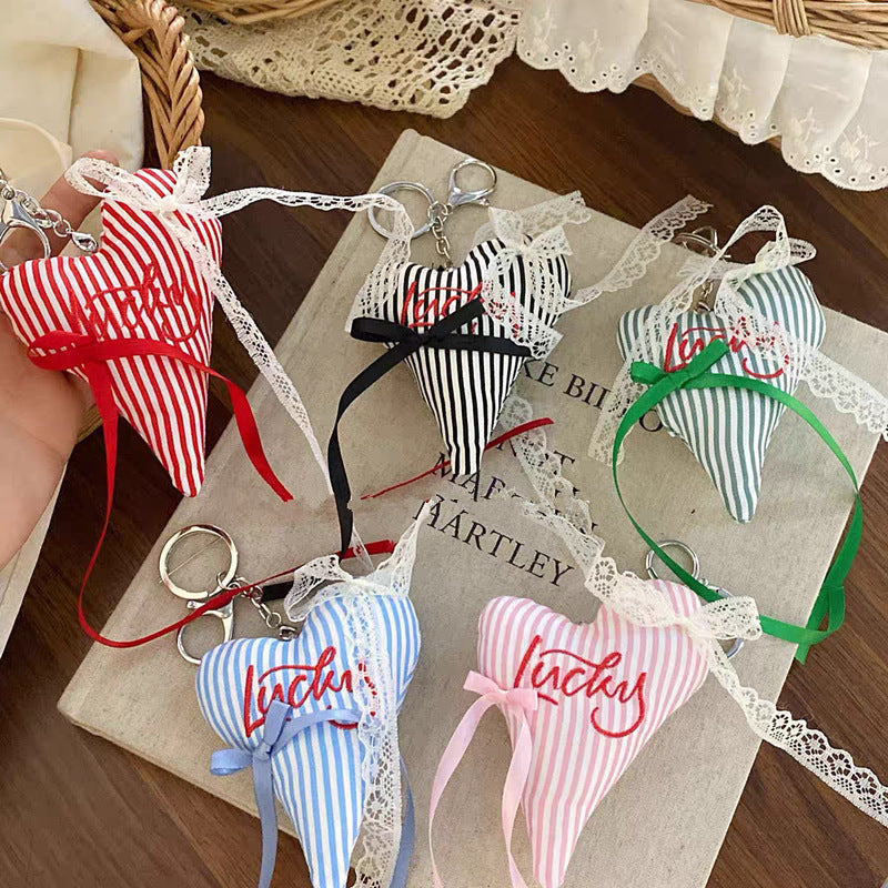 Colorful striped fabric heart keychain, a fashionable key holder & bag charm.