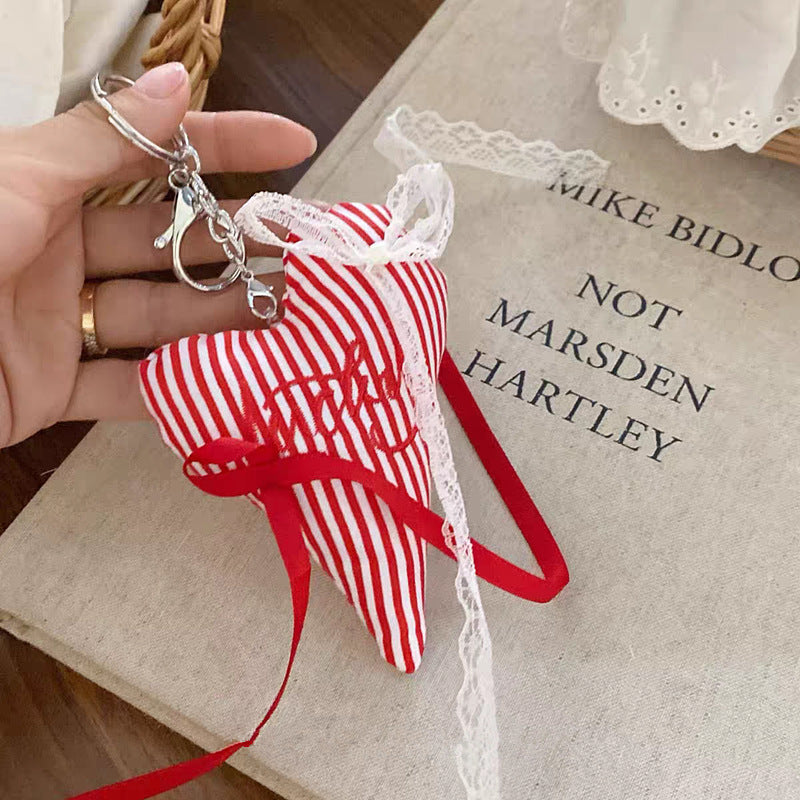 Modern fabric heart key holder, colorful stripes, a chic accessory for keys or bags.