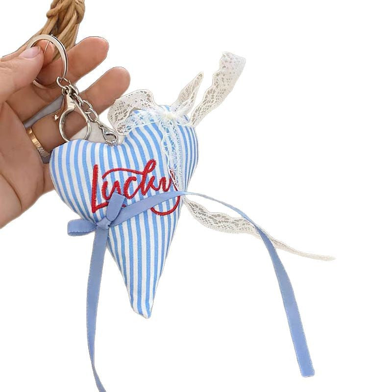 Cute heart key holder, vibrant striped fabric, perfect as a stylish bag charm.