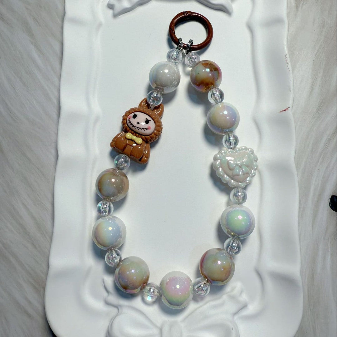 Colorful whimsical beaded bag charm & keychain, a unique personal accessory.