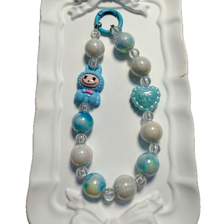 Vibrant multi-color beaded charm, handcrafted style accessory for bags & key organization.