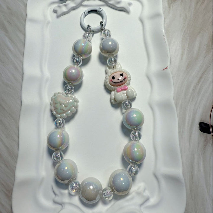 Perfect unique gift: a whimsical beaded charm, versatile as a bag accessory or keychain.