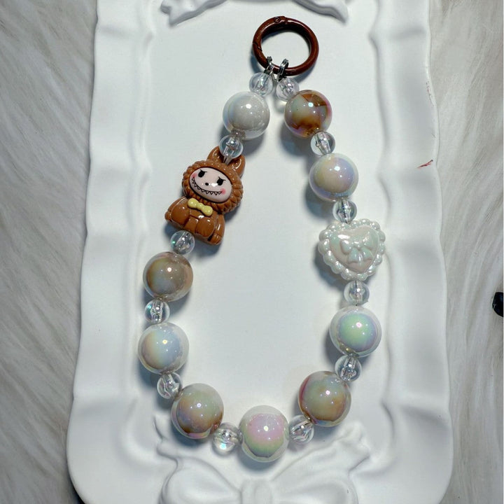 Decorative whimsical beaded charm, adds a pop of vibrant color to any bag or set of keys.