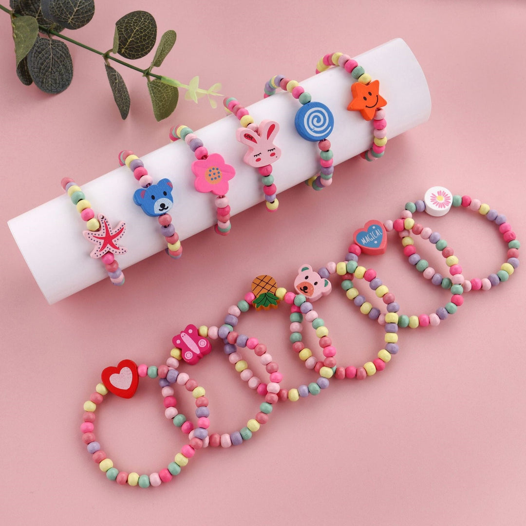 Close-up of a women's beaded charm bracelet, featuring playful, colorful beads & unique dangle charms.