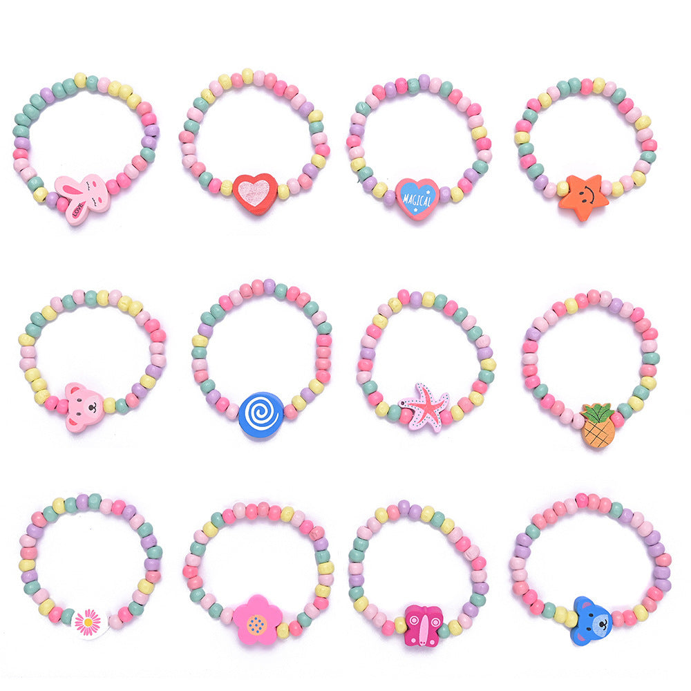 Hand modeling a playful women's beaded charm bracelet with bright, colorful beads & unique dangling charms.