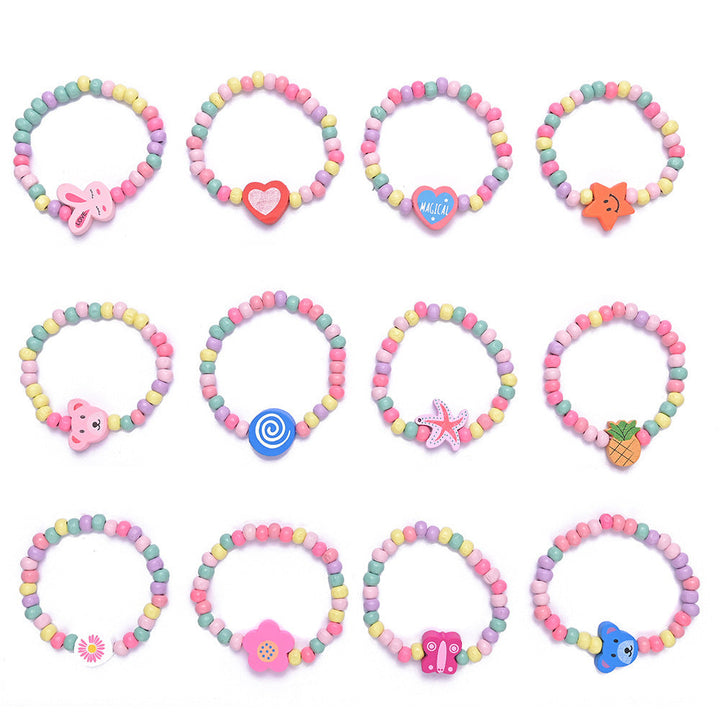 Hand modeling a playful women's beaded charm bracelet with bright, colorful beads & unique dangling charms.