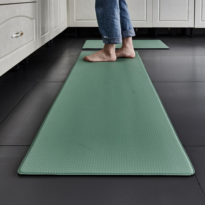 Ergonomic kitchen floor mat: anti-slip, waterproof, and cushioned for standing relief.