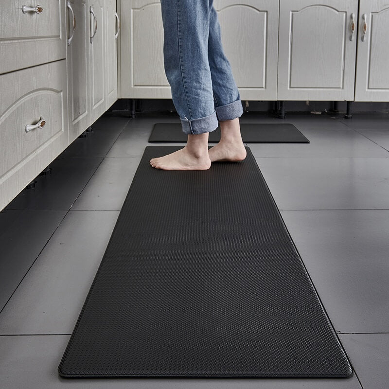Non-slip kitchen floor mat, waterproof PVC with comfort cushioning for daily kitchen tasks.