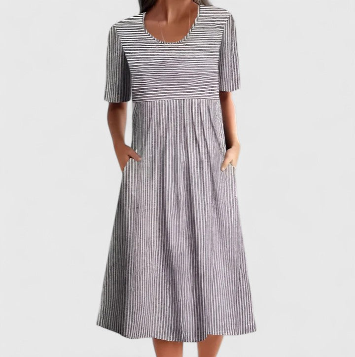 Elegant striped midi dress for women, featuring a comfortable design, versatile for summer or casual wear.