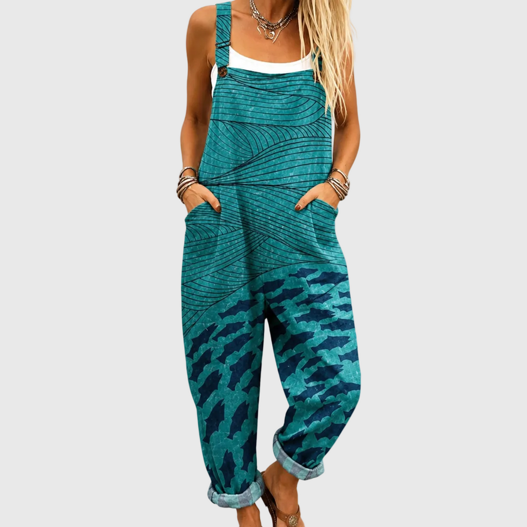 Comfortable women's flowy turquoise marine wave print jumpsuit for summer, vacation, beachwear, and casual resort wear.