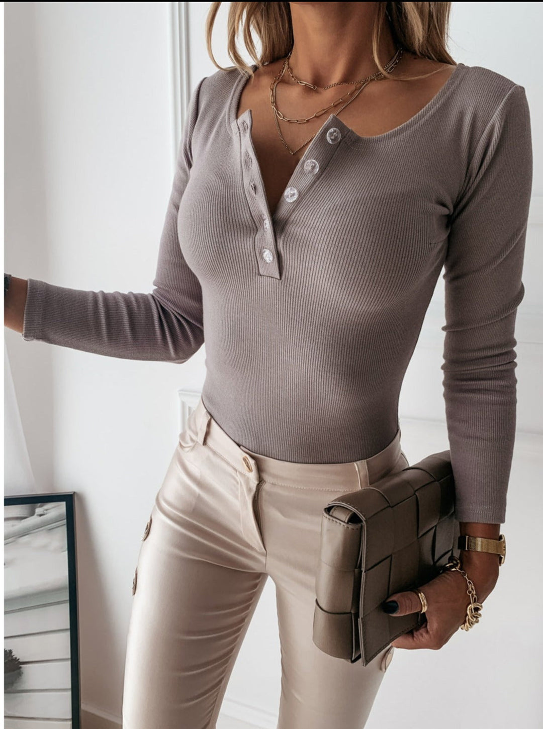 Comfortable women's ribbed Henley knit top in apricot, perfect for casual everyday wear in spring & fall.