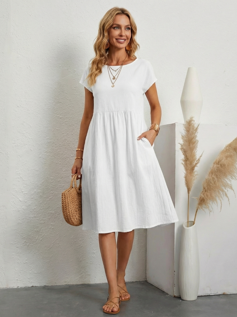 Easy-to-wear short sleeve knee-length summer dress for women, featuring pockets & a relaxed fit.