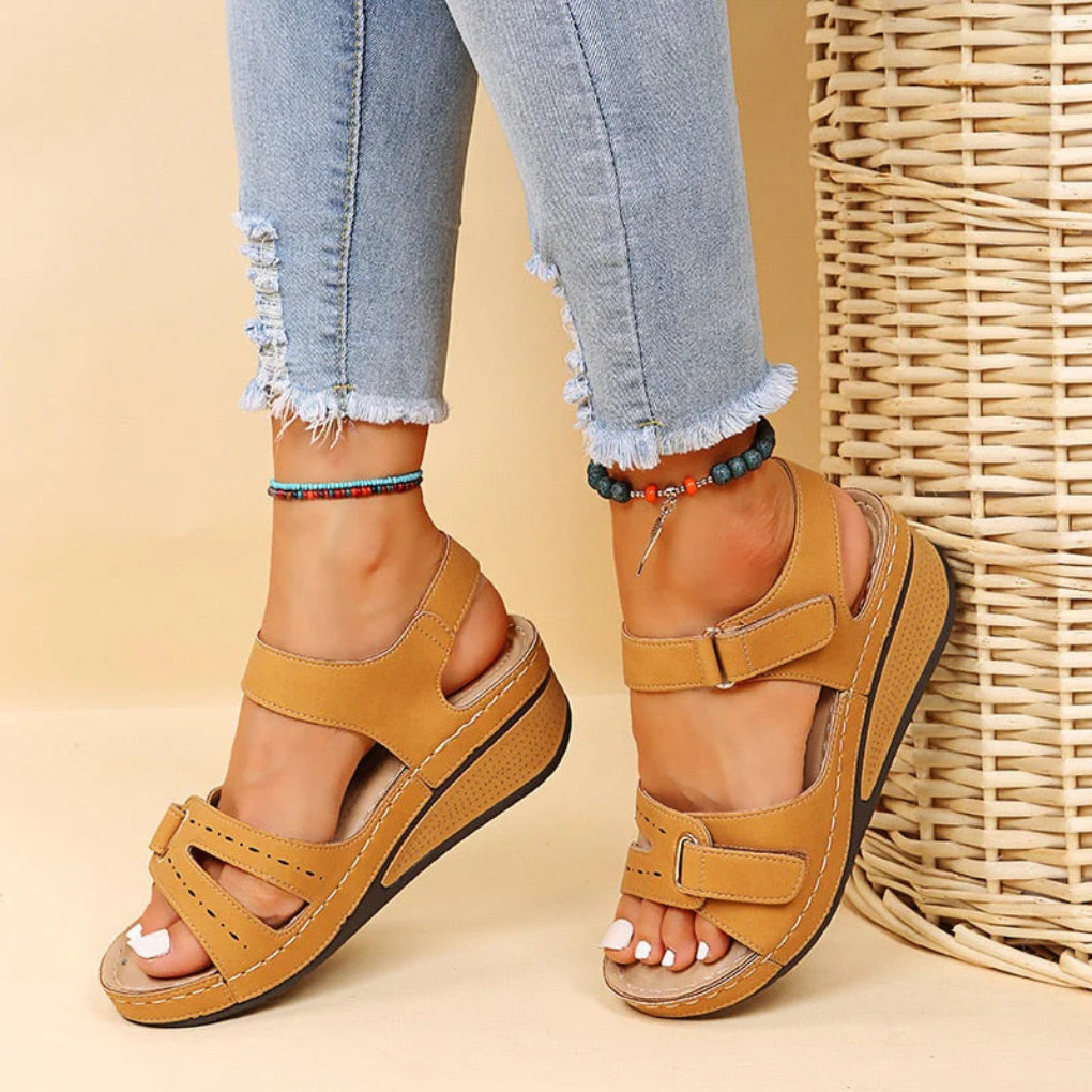 Elegant women's wedge sandals, perfect for summer casual wear or dressed-up spring fashion with an adjustable strap.