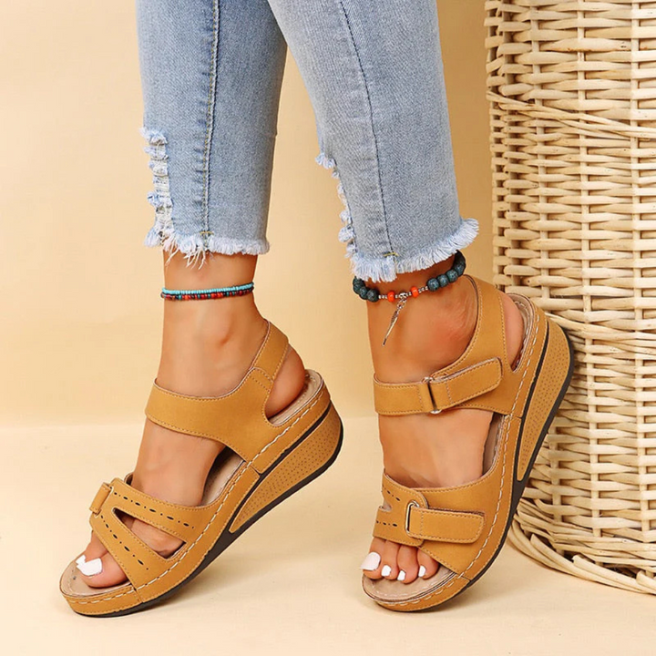 Elegant women's wedge sandals, perfect for summer casual wear or dressed-up spring fashion with an adjustable strap.
