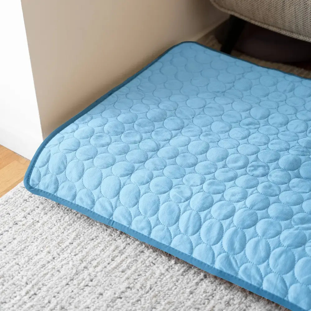 Versatile pet cooling pad, suitable for dog beds, crates, or floor. Provides year-round heat relief.