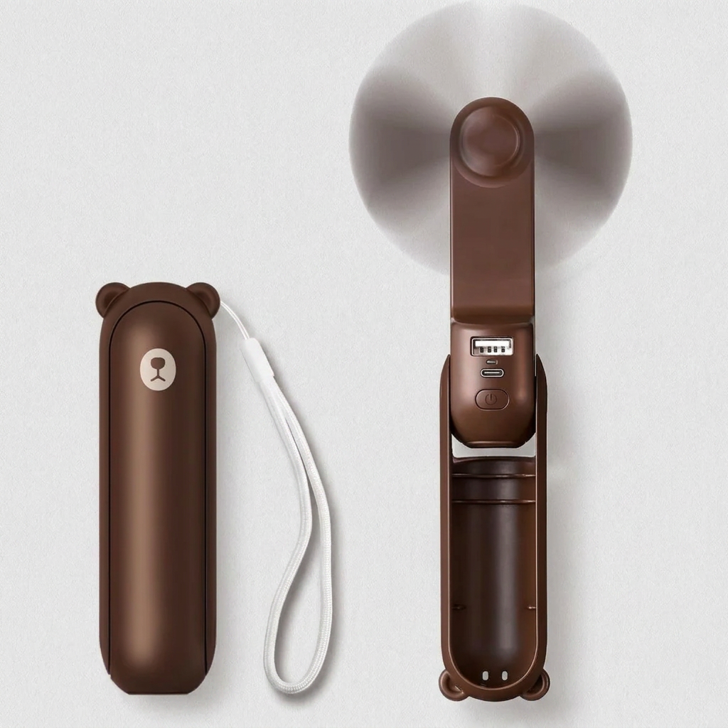 Rechargeable compact fan, power bank, & flashlight combo. Essential portable device for outdoor adventures.