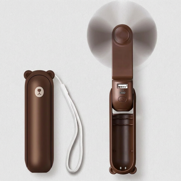 Rechargeable compact fan, power bank, & flashlight combo. Essential portable device for outdoor adventures.