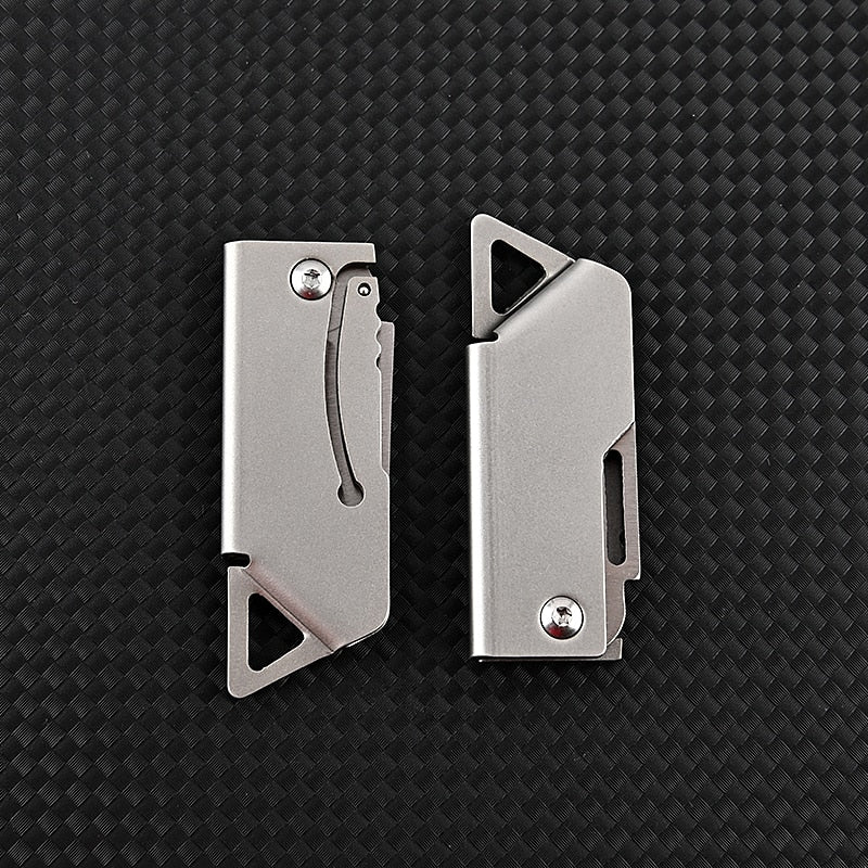 Portable D2 stainless steel folding mini survival knife. Compact pocket knife for camping, hiking, and everyday carry.