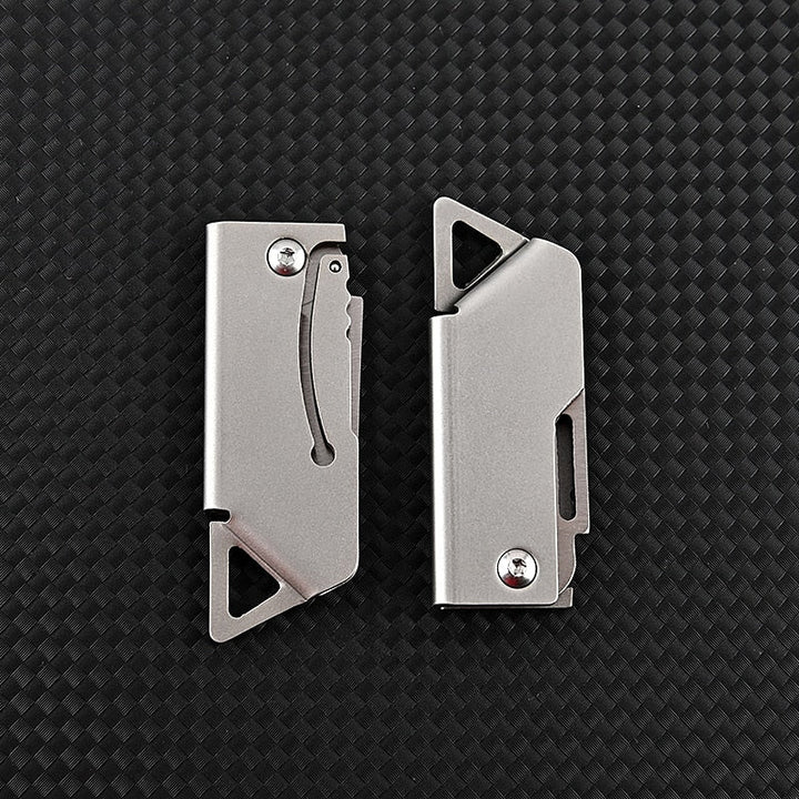 Portable D2 stainless steel folding mini survival knife. Compact pocket knife for camping, hiking, and everyday carry.