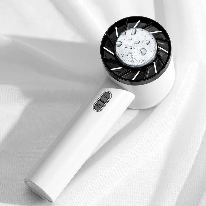 Person holding a compact rechargeable portable cooling fan for instant personal comfort.