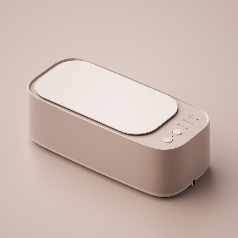 Compact ultrasonic cleaner for jewelry, glasses, watches, & small items. Deep clean & restore shine at home.