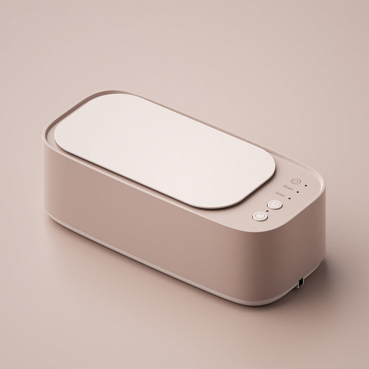 Compact ultrasonic cleaner for jewelry, glasses, watches, & small items. Deep clean & restore shine at home.