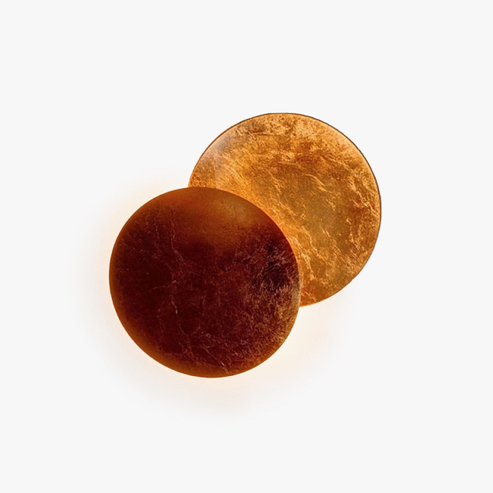 Contemporary round indoor wall light in gold for modern homes, providing ambient warm white light.