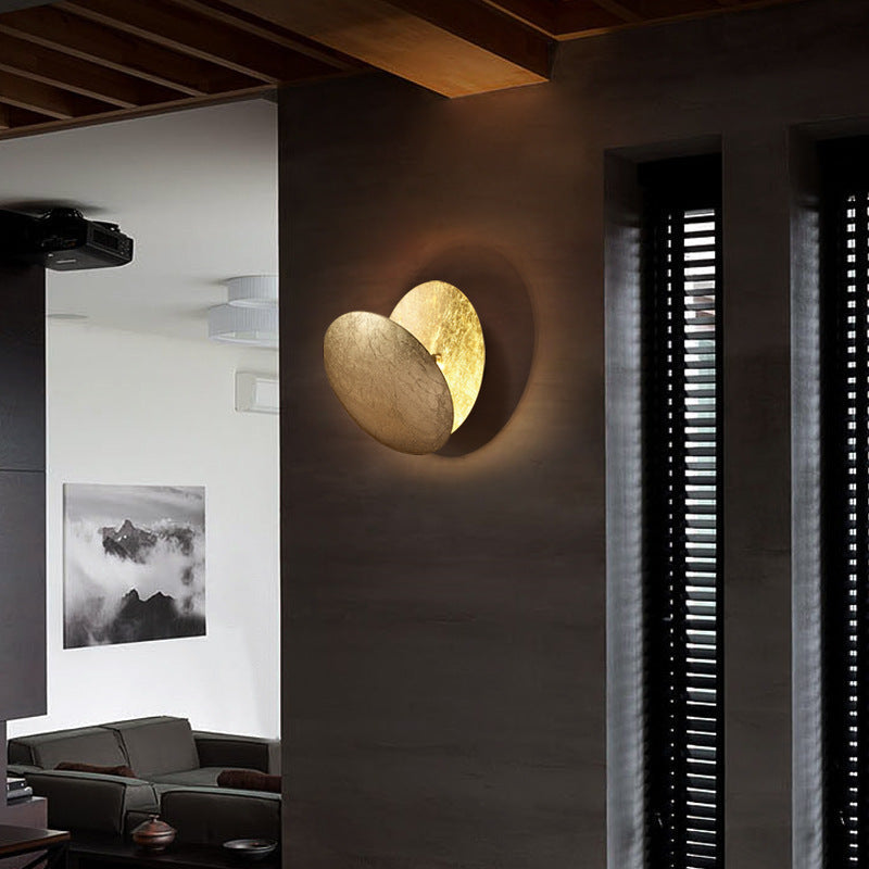 Decorative round indoor wall light, a contemporary gold metal lamp perfect for modern homes.