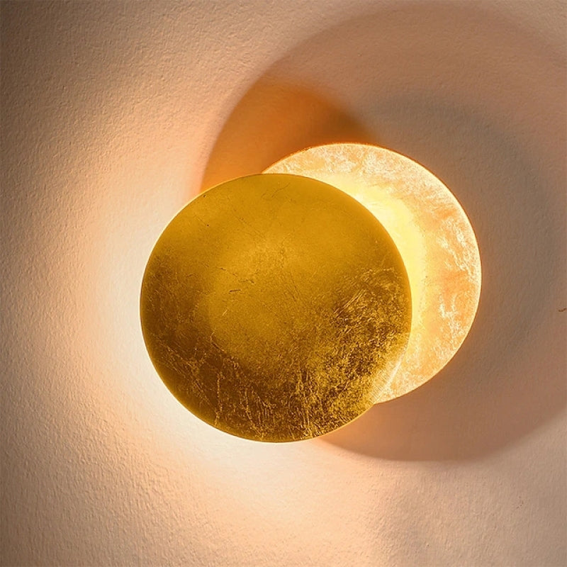 Modern metal decor: a round indoor wall light fixture with a contemporary Scandinavian design.
