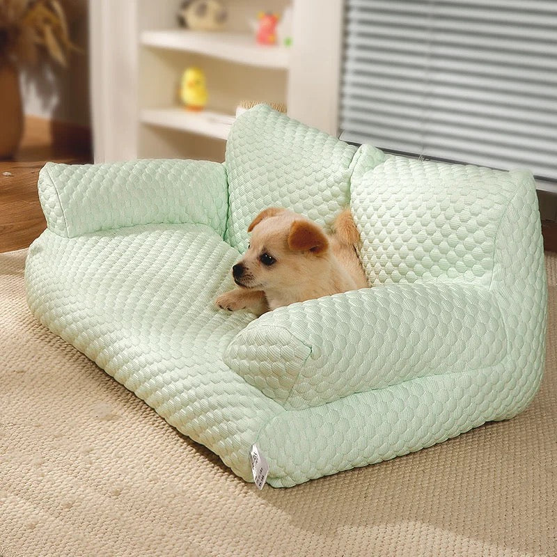 Happy dog resting comfortably on a breathable cooling pet sofa couch, ideal for summer relaxation & support.