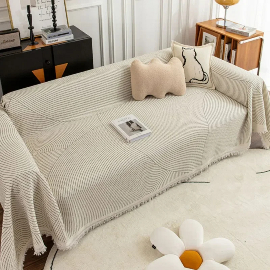 Versatile Scandinavian tassel blanket for sofa or bed, offering cozy warmth & Nordic home decor style.