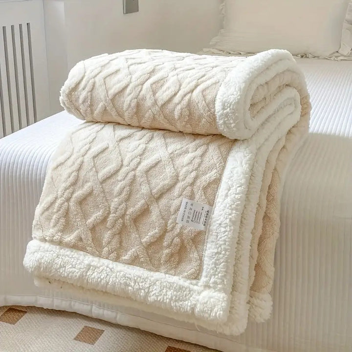 Luxuriously soft Sherpa fleece throw blanket, ideal for all-season cozy comfort and stylish home decor.
