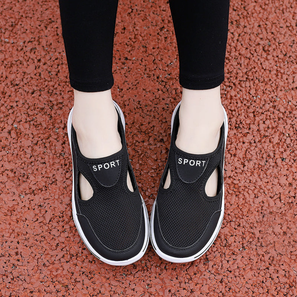 A pair of neutral-toned orthopedic house slippers, offering arch support for men's and women's foot comfort.